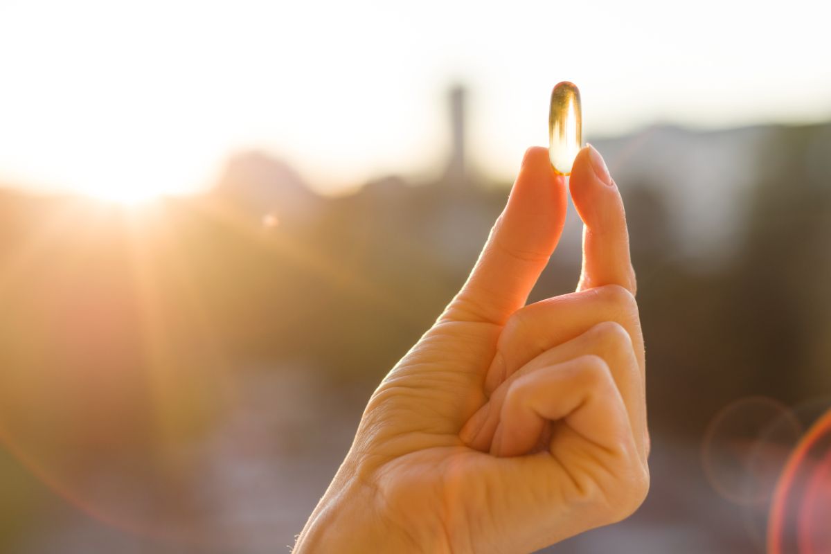 Hand Of A Woman Holding Fish Oil Omega 3 Capsules 2024 12 08 02 40 21 Utc